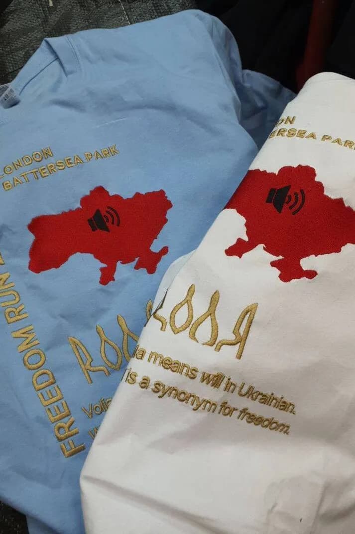 Freedom Run 2.0 event shirts with embroidered symbols