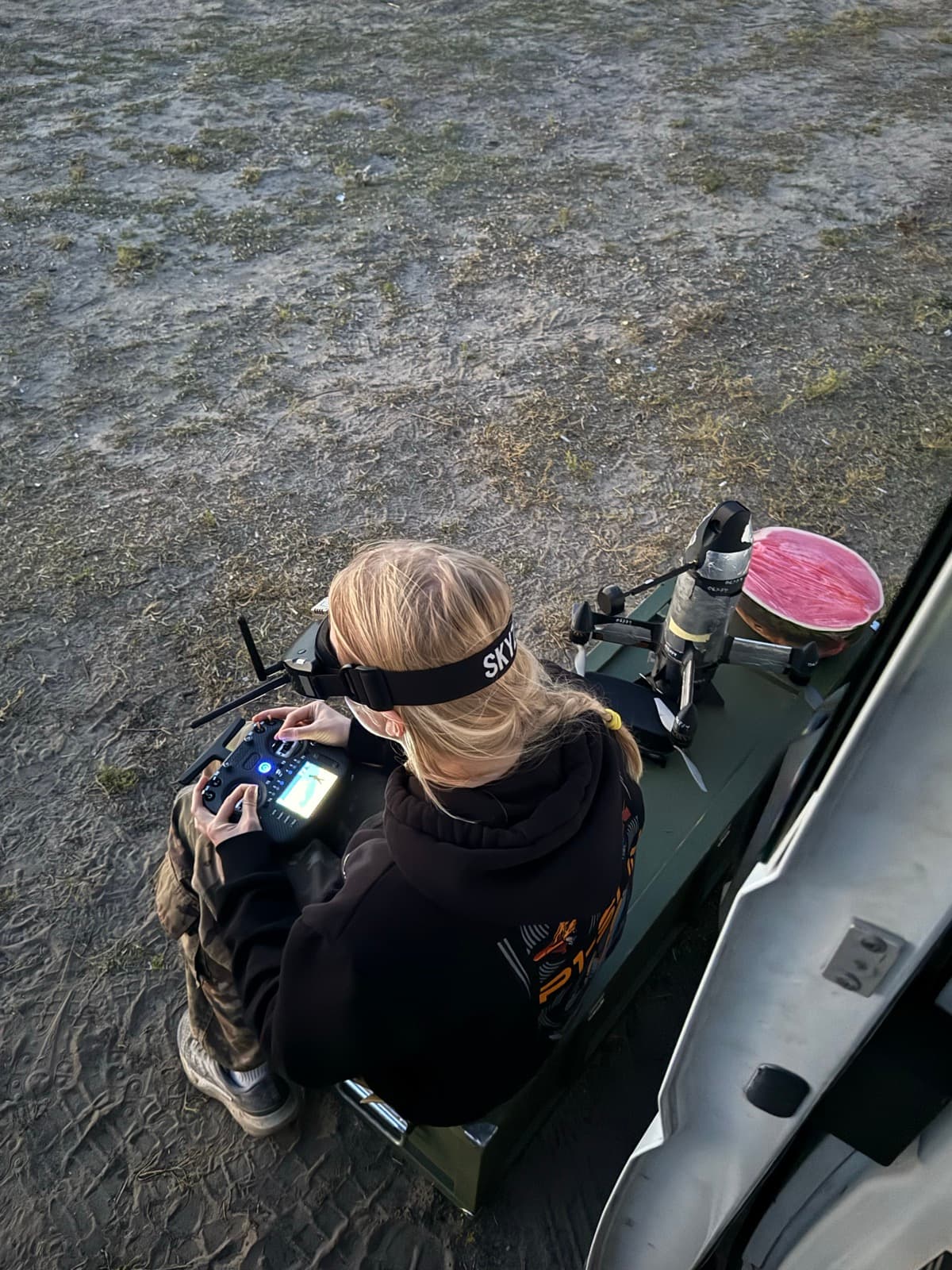 An interceptor-drone operator training with an FPV controller