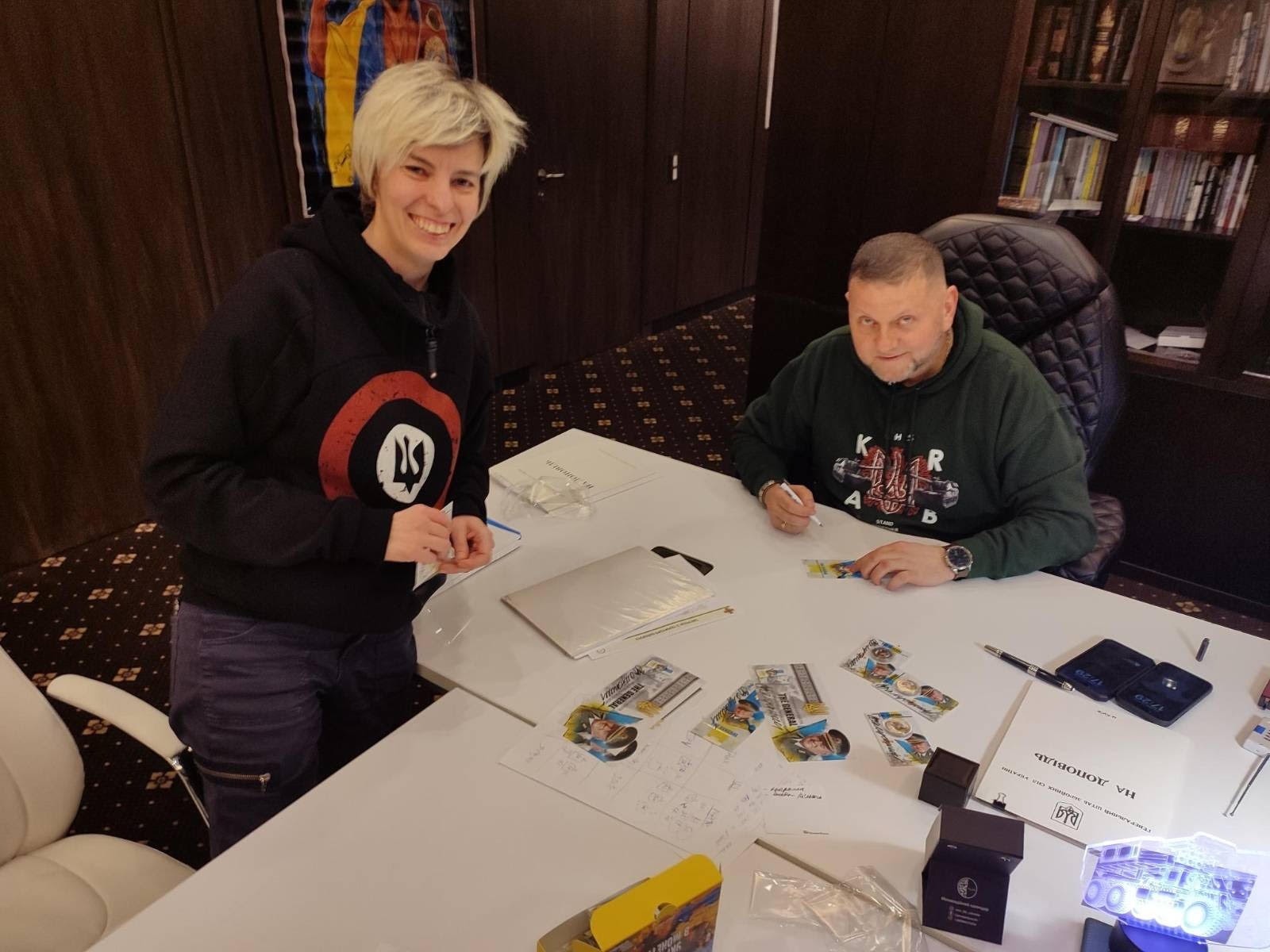 General Zaluzhnyi signing in his Kyiv office